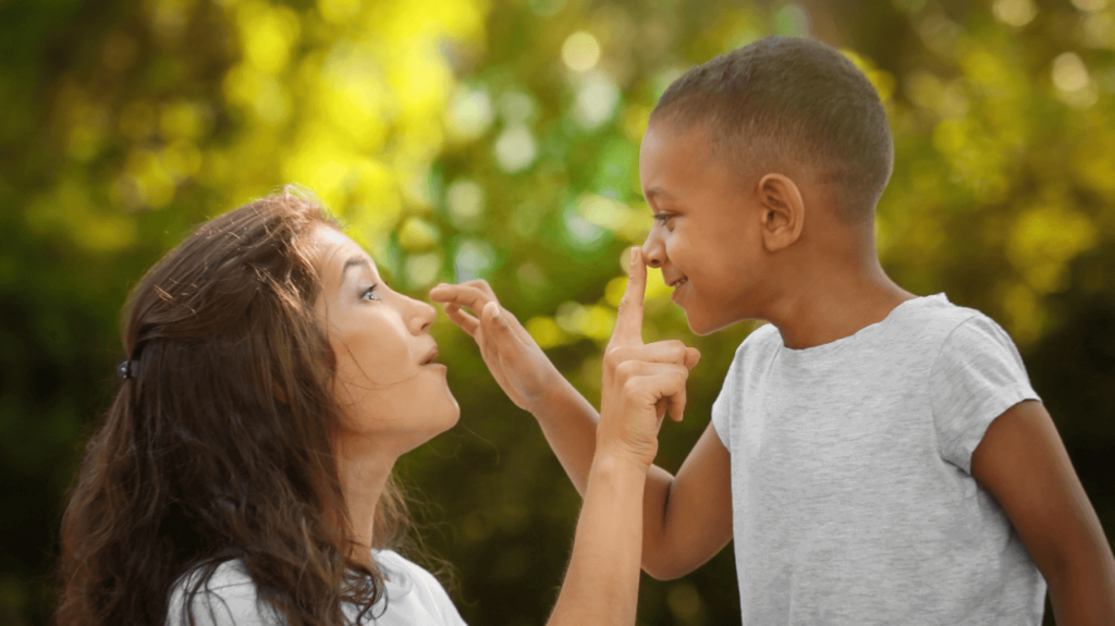 adoptive mother playing with her son