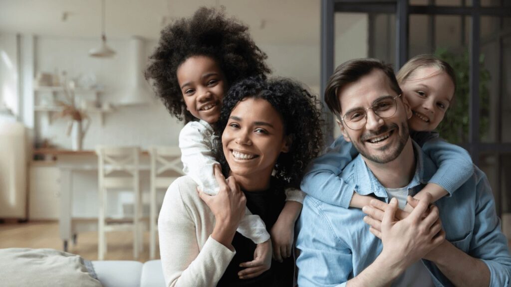 happy blended family smiling at camera