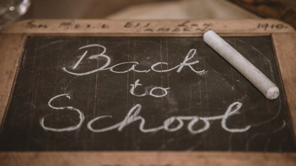 chalkboard with chalk on top of it