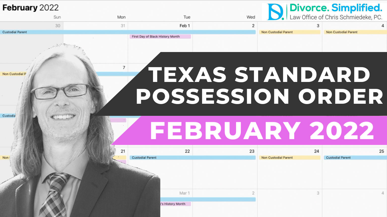 man standing in front of a February calendar