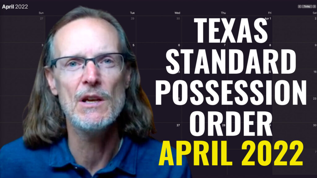 man standing in front of a April calendar