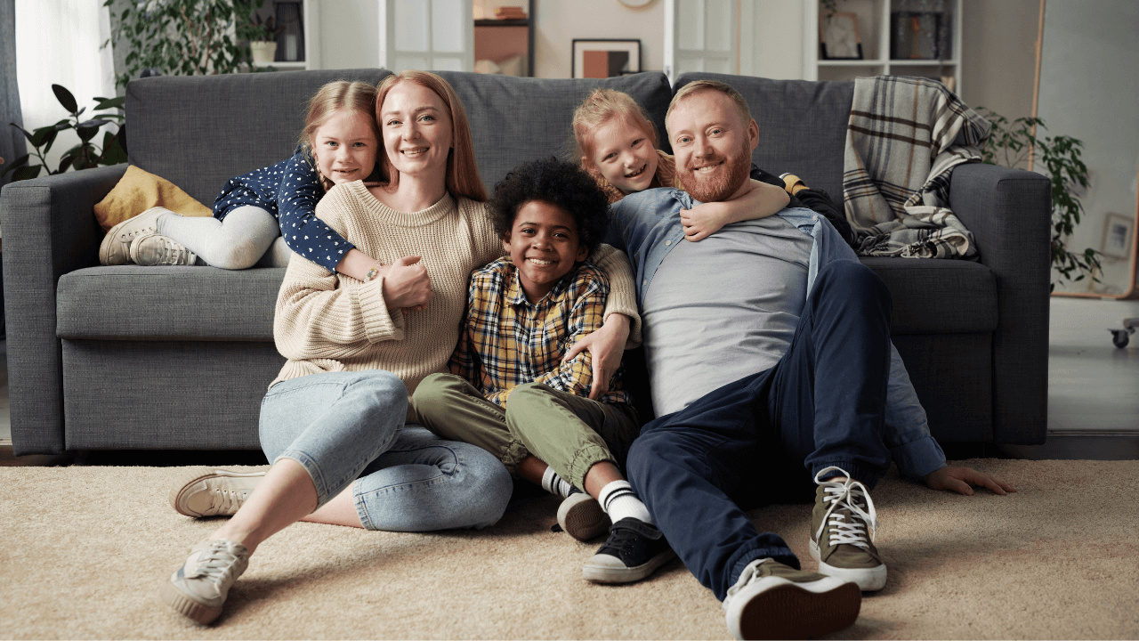 A husband and wife with their children