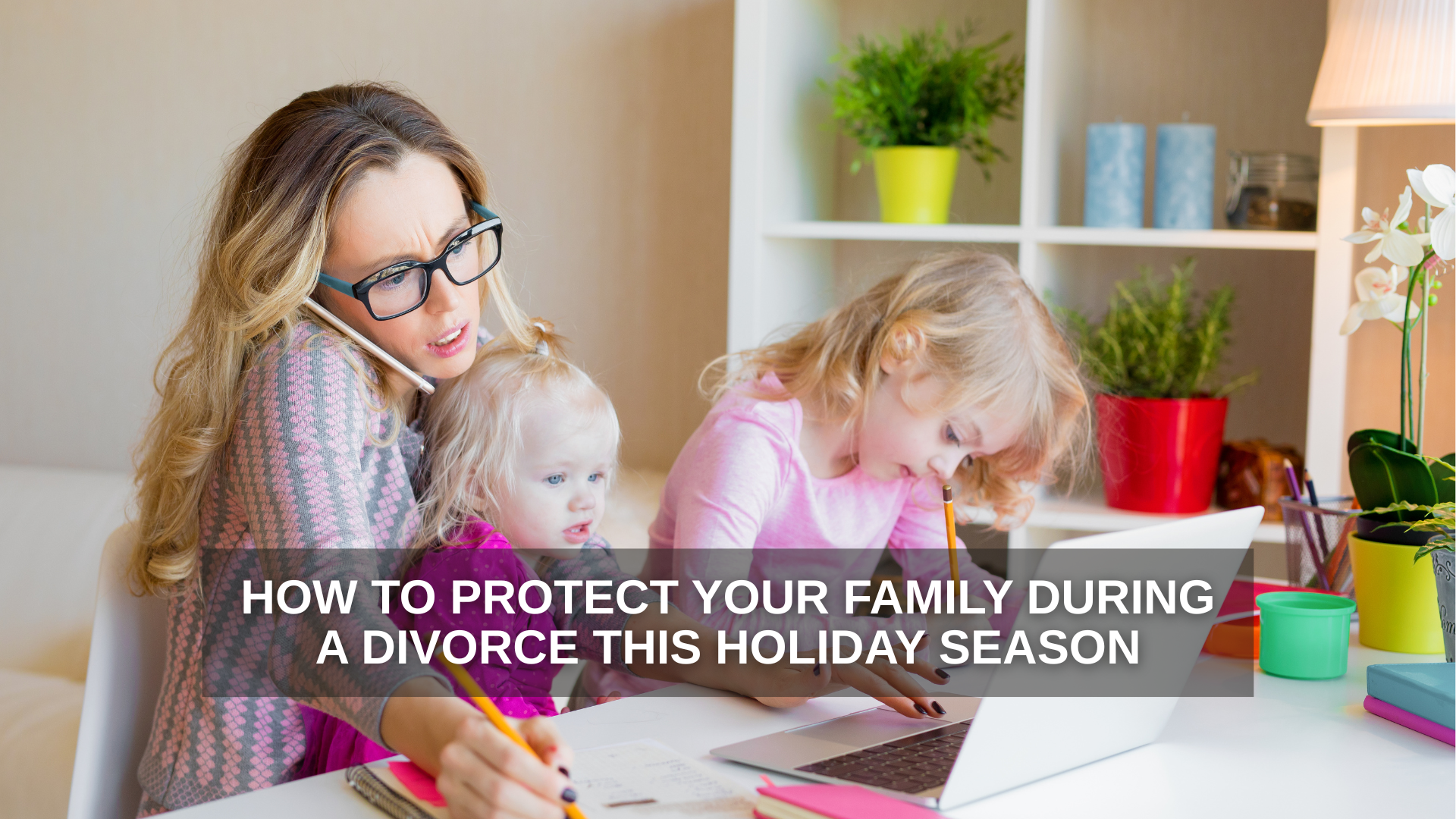 A stressed stay-at-home mom multitasks during a phone call while holding a toddler on her lap and helping an older child with homework at a cluttered desk, symbolizing the challenges of protecting a family during a holiday-season divorce.