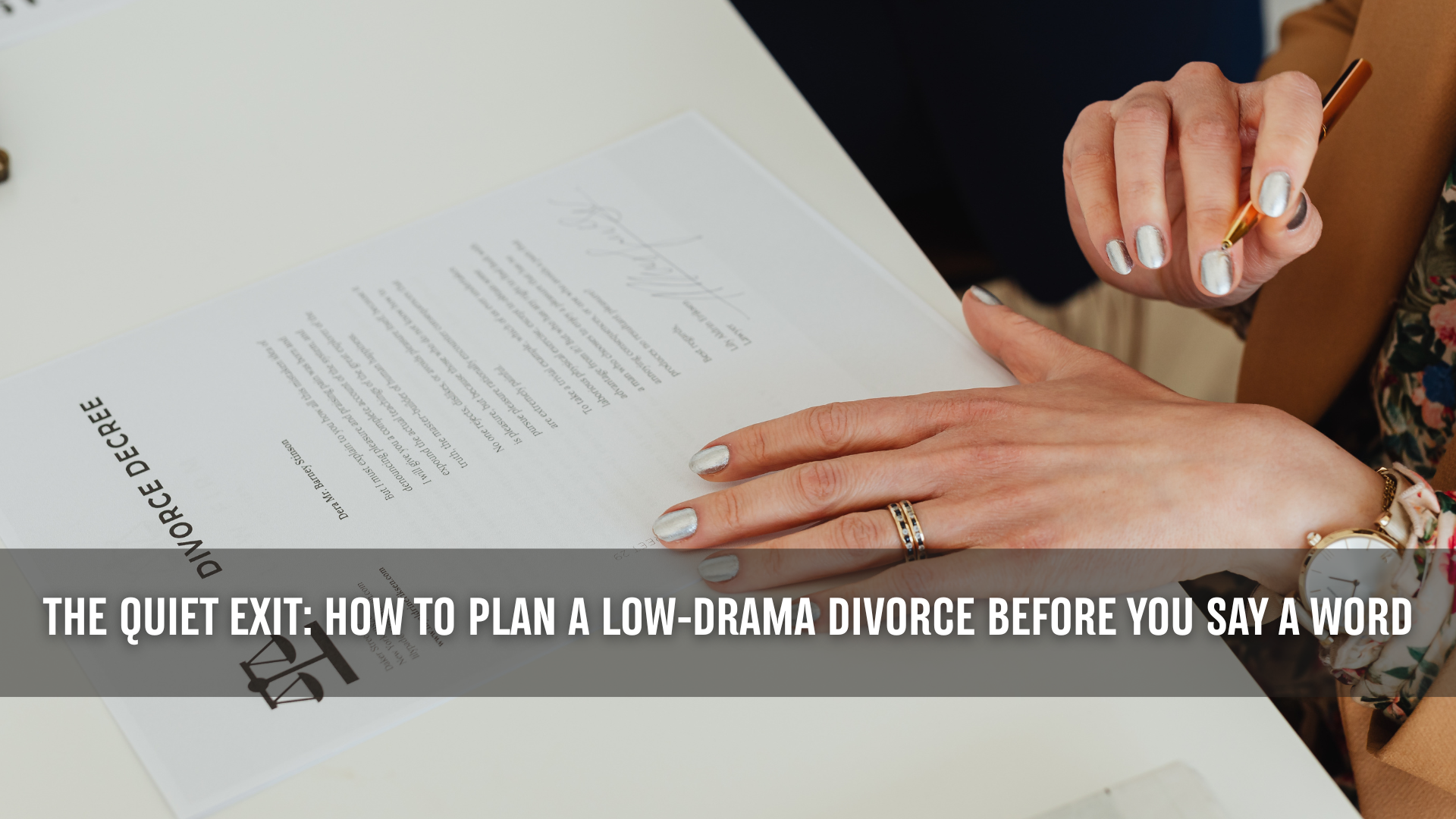 Close-up of a woman signing a divorce decree with a pen, representing how to plan a low conflict divorce in Texas with a calm, intentional approach.
